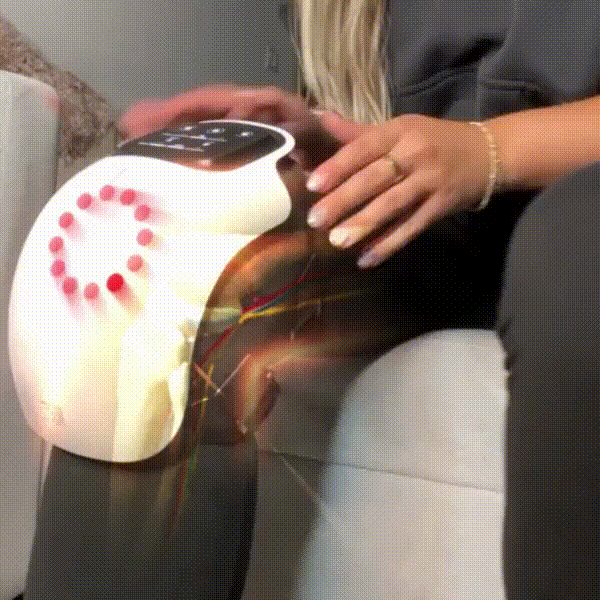 Person using a 3 in 1 therapy massager for pain relief on their knee.